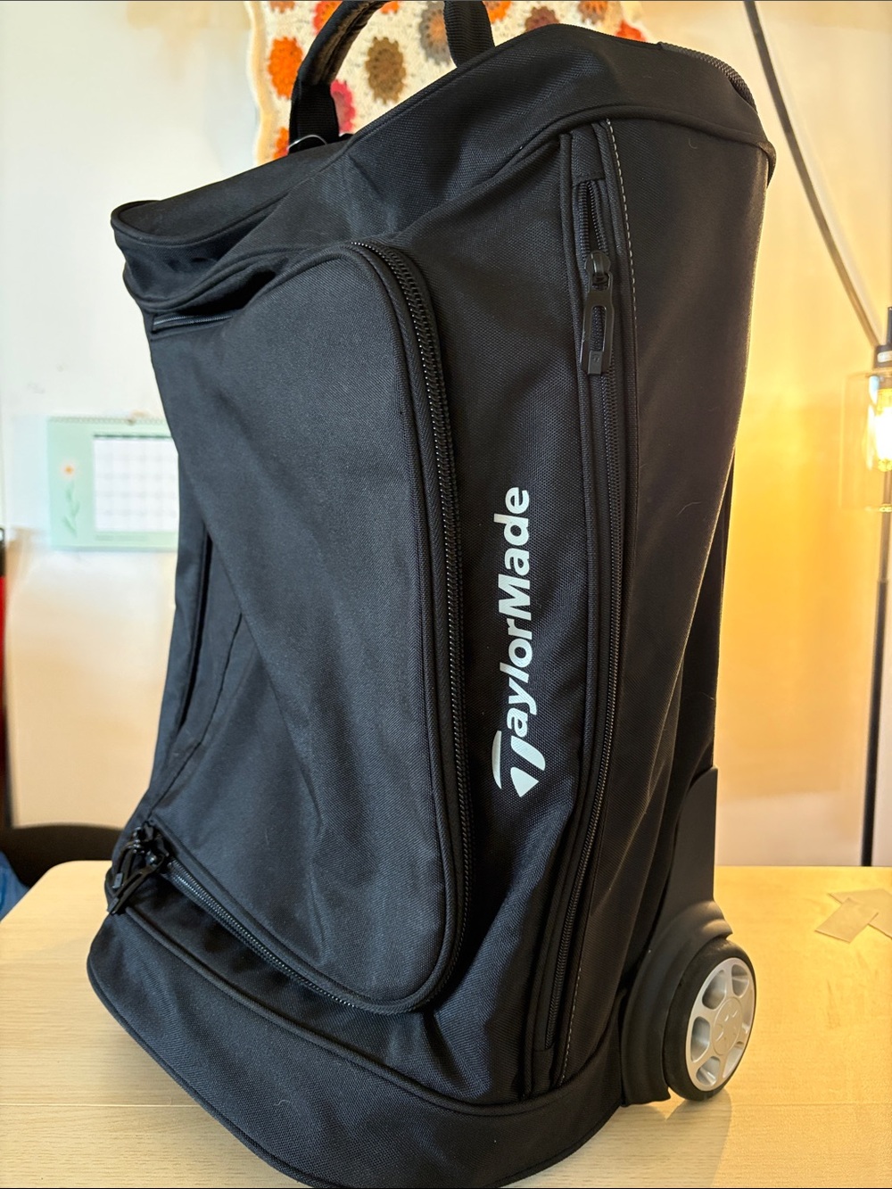 TaylorMade Black Rolling Travel Bag with Side Logo